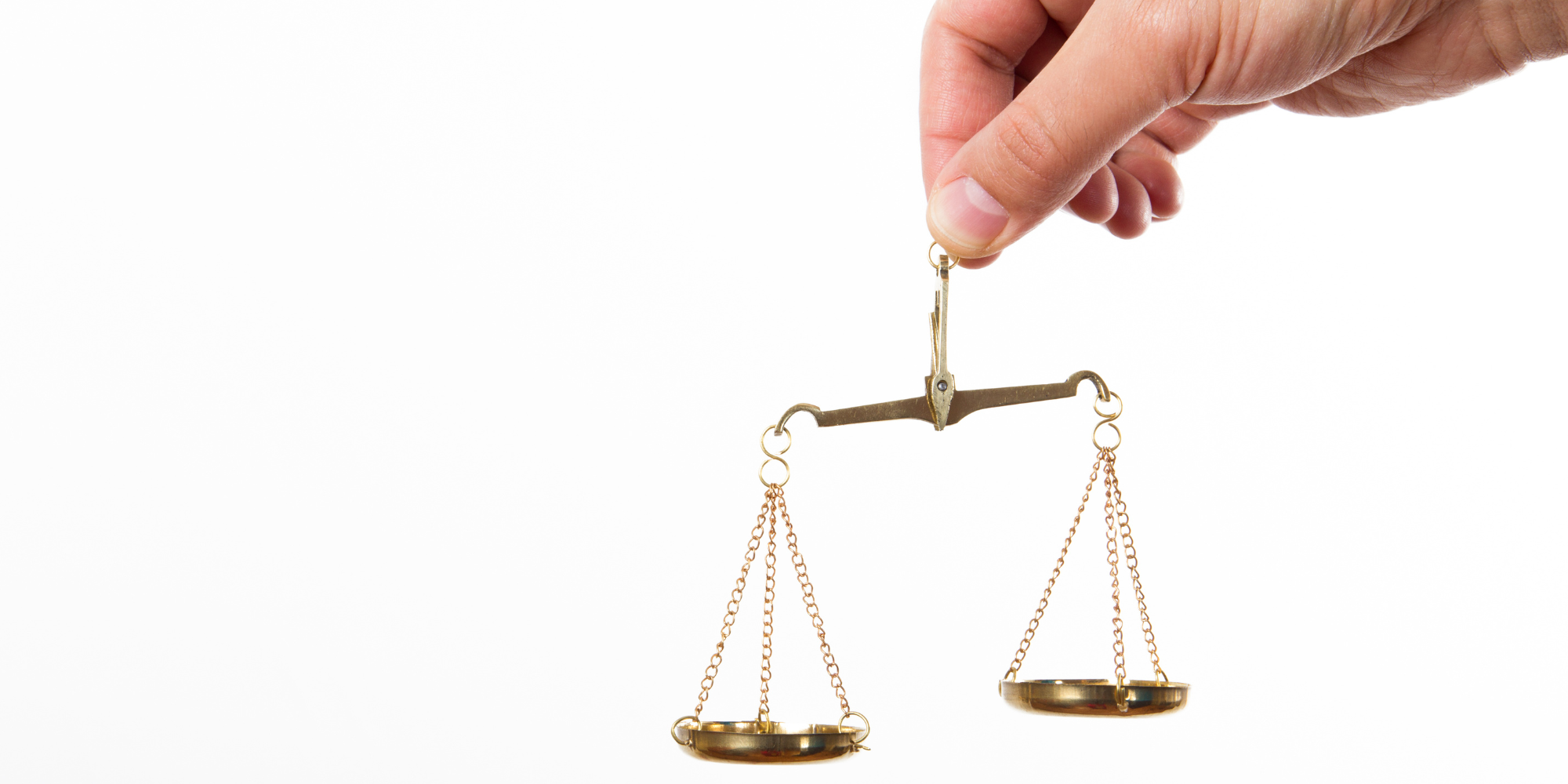 Hand holding a scale