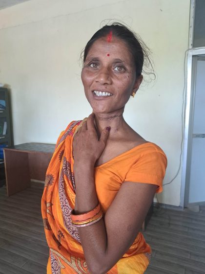 woman wearing an orange sari