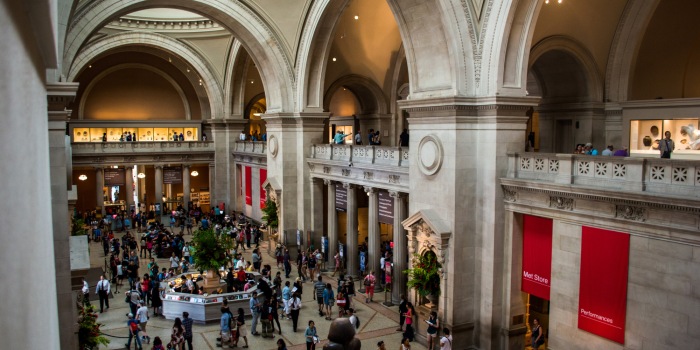 view of the met's lobby full of visitors