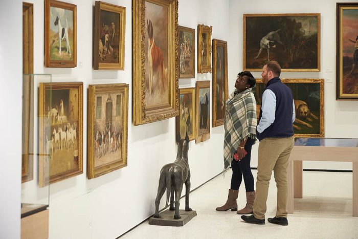 two people admiring artwork