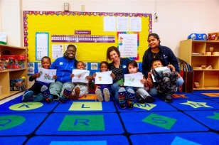 Young children showcasing their art