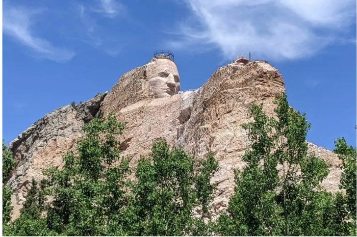 image of crazy horse memorial set against blue sky