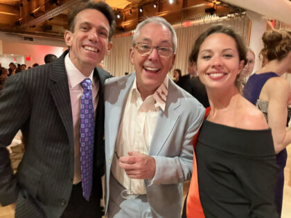 Group photo of 3 people at a gala