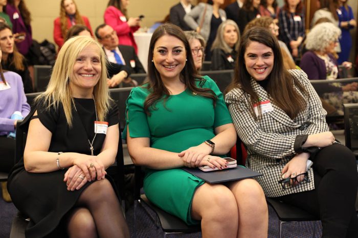 three women sitting together at a national council of jewish women event