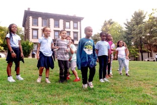 Group of children exploring outside