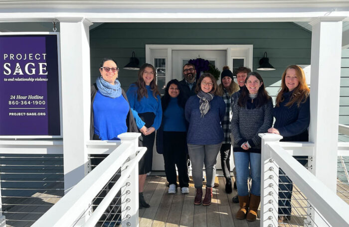 Project SAGE employees posing at the headquarters