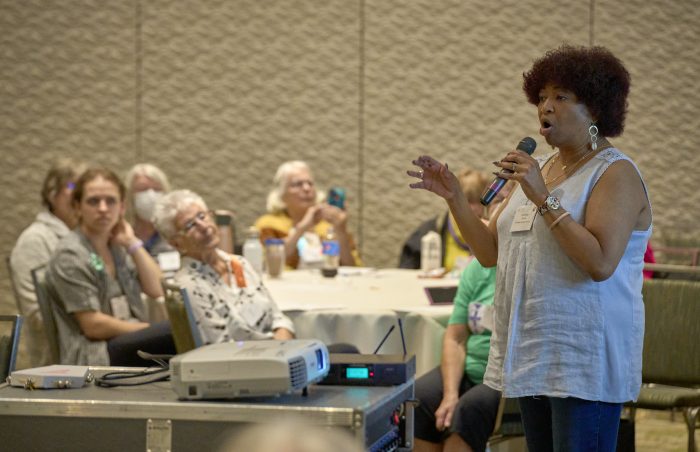 a woman presenting to a group of women